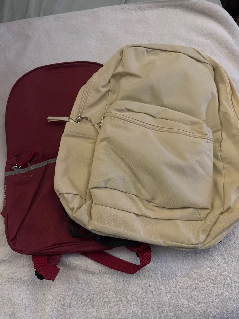 Beige and Burgundy Two Backpacks
